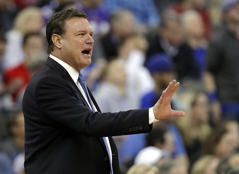 Kansas men's basketball coach Bill Self talks to his players during Sunday's Midwest Regional final against Duke. Kansas won 85-81 in overtime to reach the Final Four, joining Loyola-Chicago, Michigan and Villanova in next weekend's national semifinals in San Antonio.