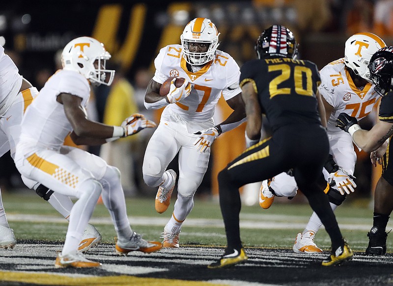 Tennessee running back Carlin Fils-aime (27) runs with the ball during the first half of an NCAA college football game against Missouri Saturday, Nov. 11, 2017, in Columbia, Mo. (AP Photo/Jeff Roberson)