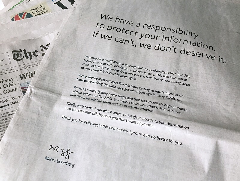 An advertisement in The New York Times is displayed on Sunday, March 25, 2018, in New York. Facebook's CEO apologized for the Cambridge Analytica scandal with ads in multiple U.S. and British newspapers Sunday. The ads signed by Mark Zuckerberg say the social media platform doesn't deserve to hold personal information if it can't protect it. (AP Photo/Jenny Kane)