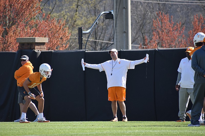Jeremy Pruitt gestures while working with Tennessee's defensive backs during a practice on March 22.


