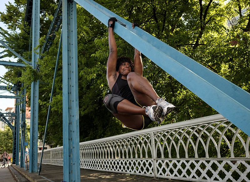 Danyelle Hambright exercises on the Walnut Street Bridge in 2016.