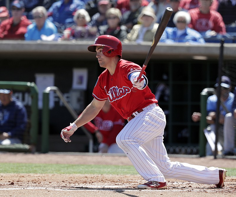 
              FILE - In this March 13, 2018, file photo, Philadelphia Phillies' Scott Kingery bats in a spring baseball exhibition game against the Tampa Bay Rays,  in Clearwater, Fla.  Kingery has shown the Phillies he's ready to play in the majors even if it takes a bit longer for him to get there. Kingery is considered the top second-base prospect in baseball and already has been compared to Craig Biggio and Dustin Pedroia. But Cesar Hernandez is Philadelphia's starting second baseman so Kingery has been playing other positions in spring training.(AP Photo/John Raoux, File)
            