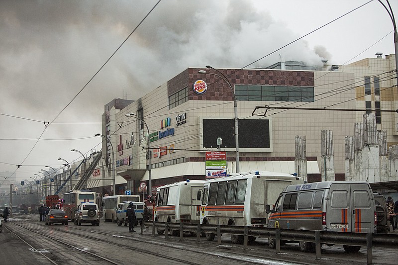 Smoke rises above a multi-story shopping center in the Siberian city of Kemerovo, about 3,000 kilometers (1,900 miles) east of Moscow, Russia, on Sunday, March 25, 2018.