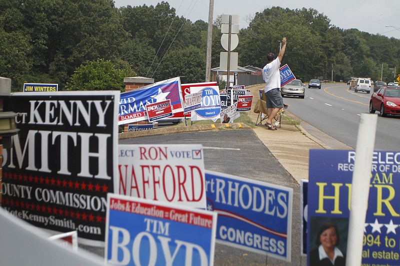 Campaign signs from a previous election clutter the side of East Brainerd Road.