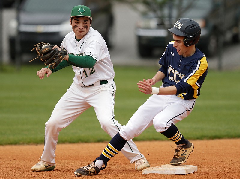 CCS runner Amos Davenport beats the tag by Notre Dame 2nd baseman Daniel Anderson during their prep baseball game at Notre Dame High School on Tuesday, March 27, 2018, in Chattanooga, Tenn. 