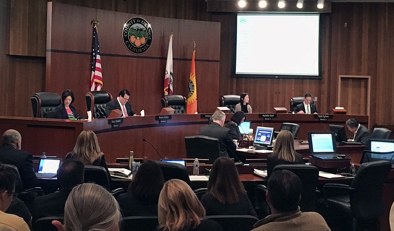The Orange County board of supervisors gather during a meeting in Santa Ana, Calif. on Tuesday, March 27, 2018. Orange County is considering two proposals to fight back against California's so-called sanctuary law for immigrants. The backlash to the state's effort to protect immigrants from stepped up deportations under the Trump administration comes a week after a small city voted to seek to exempt itself from the law. (AP Photo/Amy Taxin)