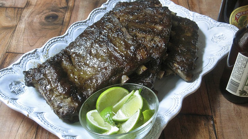 This Saturday March 17, 2018 photo shows oven-baked jerk spareribs in New York. This dish is from a recipe by Sara Moulton. (Sara Moulton via AP)
