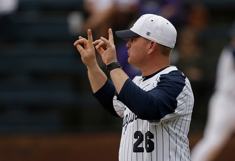 Gordon Lee baseball coach Mike Dunfee signals to players during their prep baseball game against Darlington at Gordon Lee High School on Wednesday, March 28, 2018, in Chickamauga, Ga. 