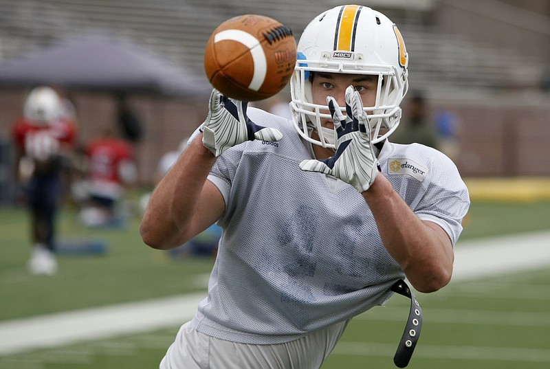 UTC tight end Jacob Webster locks in on a pass during a practice drill Wednesday at Finley Stadium. He impressed the Mocs coaches in the spring practices.