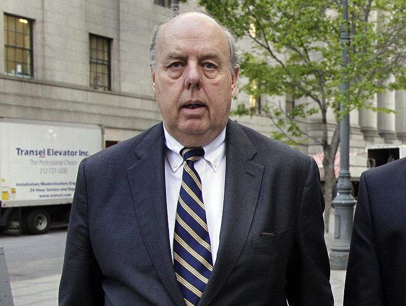 FILE - In this April 29, 2011, file photo, attorney John Dowd walks in New York. One of President Donald Trump’s attorneys floated the possibility of pardoning two of the president’s former advisers caught up in the Russia probe in discussions with their lawyers last year, The New York Times reported Wednesday, March 28, 2018. The newspaper, citing three anonymous people with knowledge of the discussions, says that then-Trump attorney, John Dowd, raised the idea with attorneys for former Trump campaign chairman Paul Manafort and former national security adviser Michael Flynn. (AP Photo/Richard Drew, File)