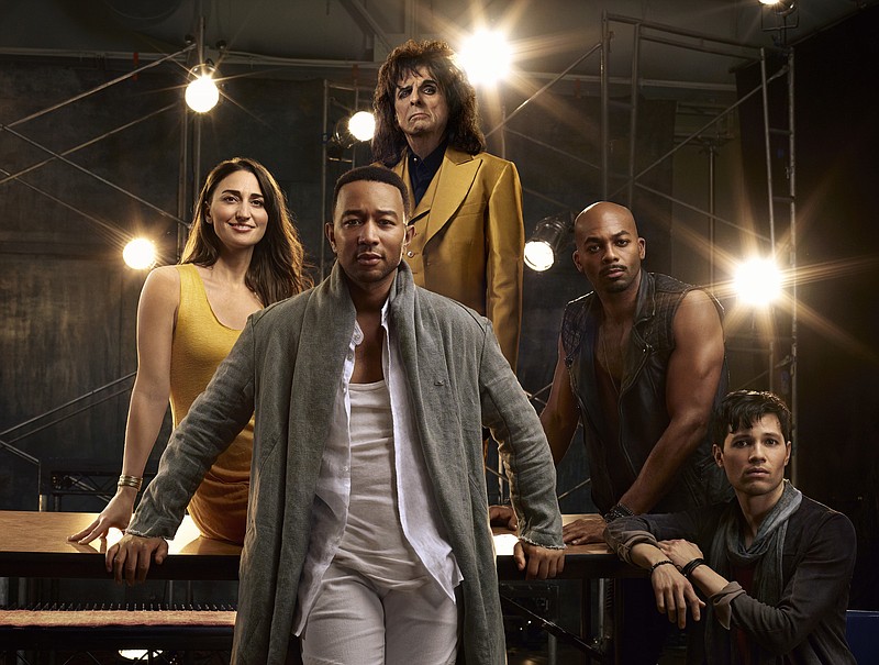 This image released by NBC shows, clockwise from foreground center, John Legend as Jesus Christ, Sara Bareilles as Mary Magdalene, Alice Cooper as King Herod, Brandon Victor Dixon as Judas Iscariot and Jason Tam as Peter from the NBC production, "Jesus Christ Superstar Live In Concert," airing April 1. (James Dimmock/NBC via AP)