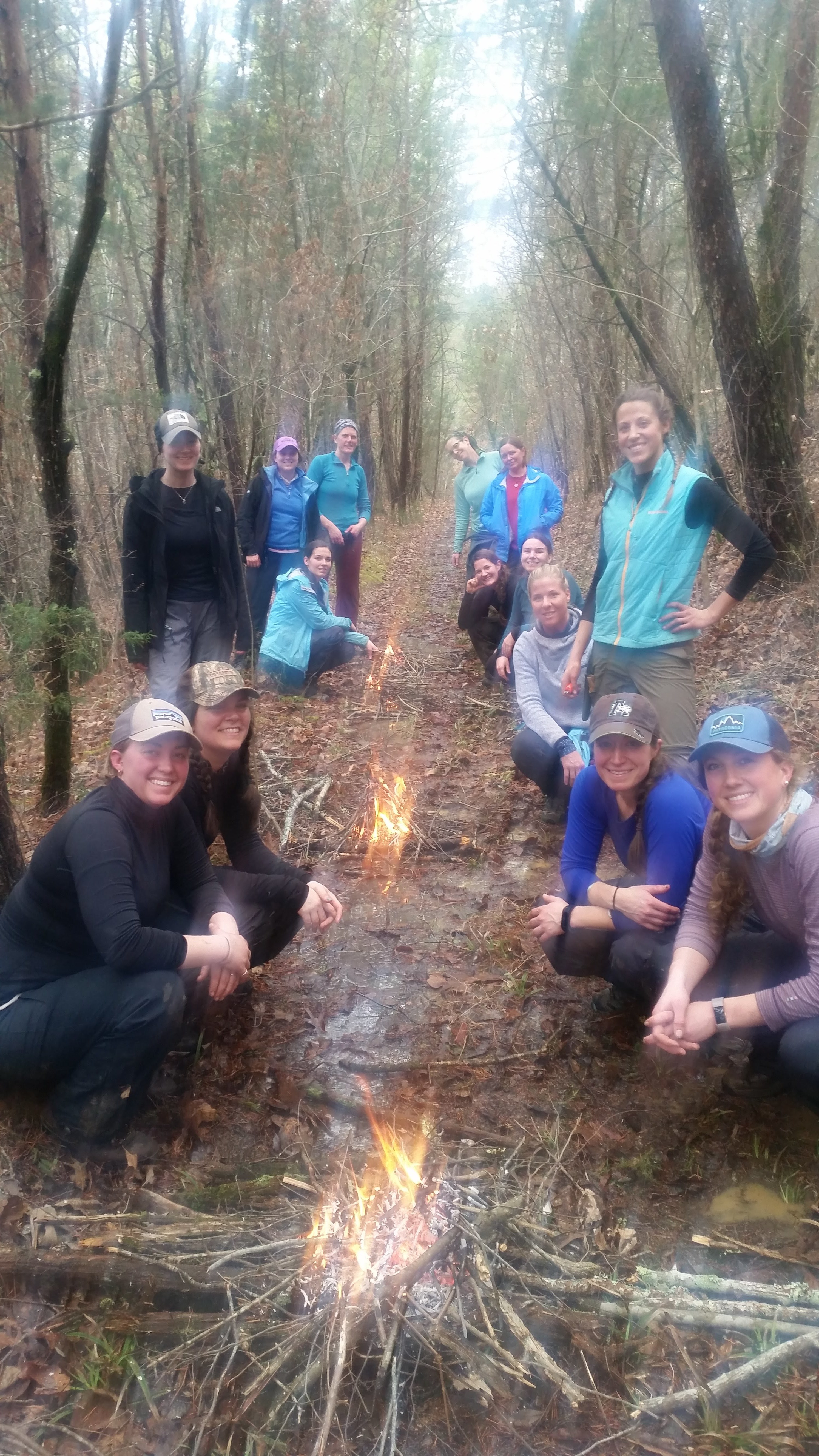 Fire building was a big focus of the workshop, and friendly competitions taught participants to build fast and effective fires, even in the rain. Photo by Andrew Herrington