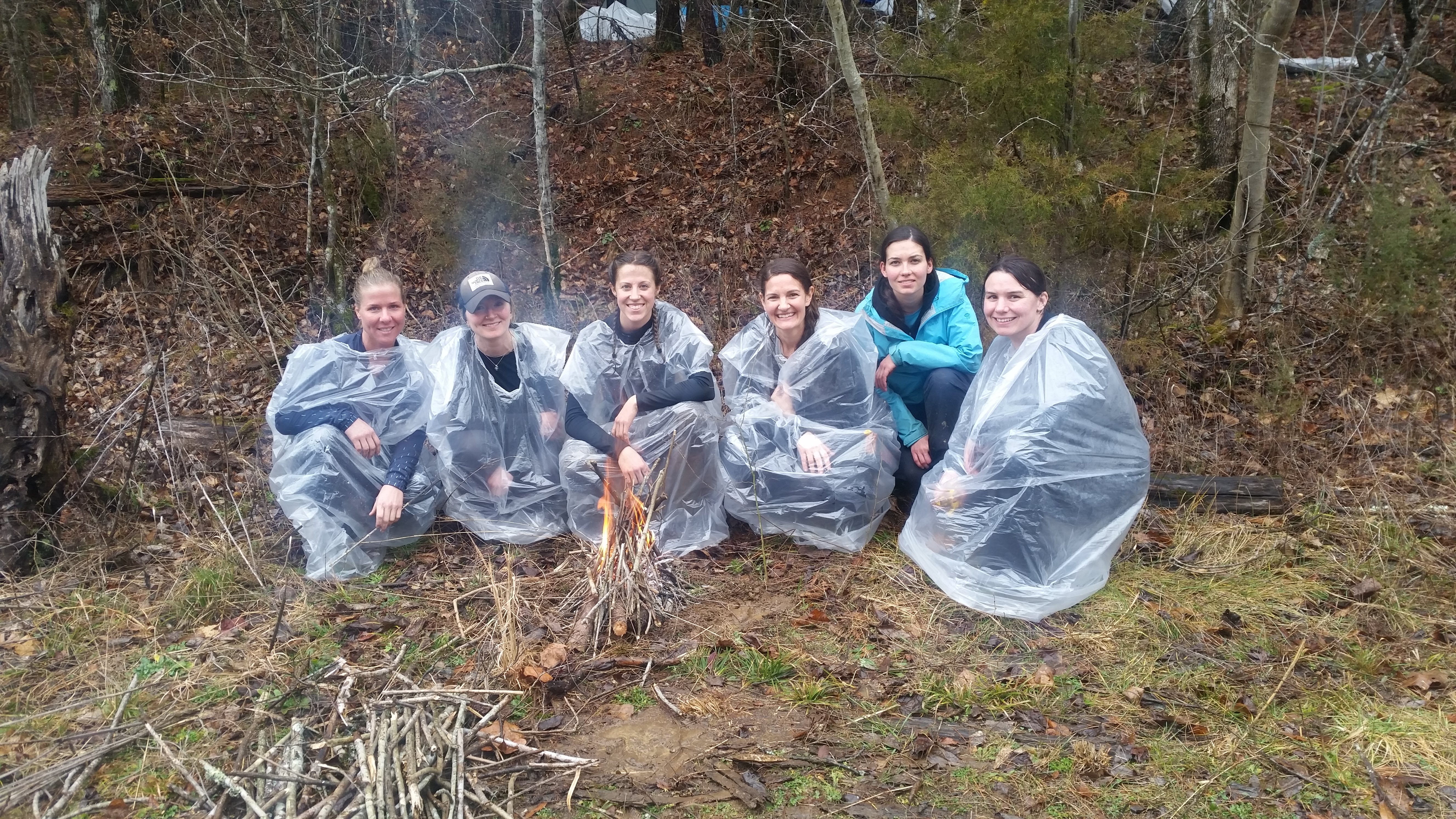 Following the immersion — shivering and near hypothermia — the women put their fire-building skills to the ultimate test. Photo by Andrew Herrington