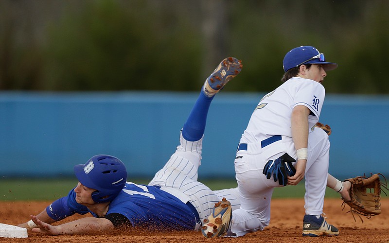 Bremen runner Brooks Hardie makes 2nd ahead of a throw to Ringgold shortstop Nathan Camp during their prep baseball game against Bremen at Ringgold High School on Friday, March 30, 2018, in Ringgold, Ga. 