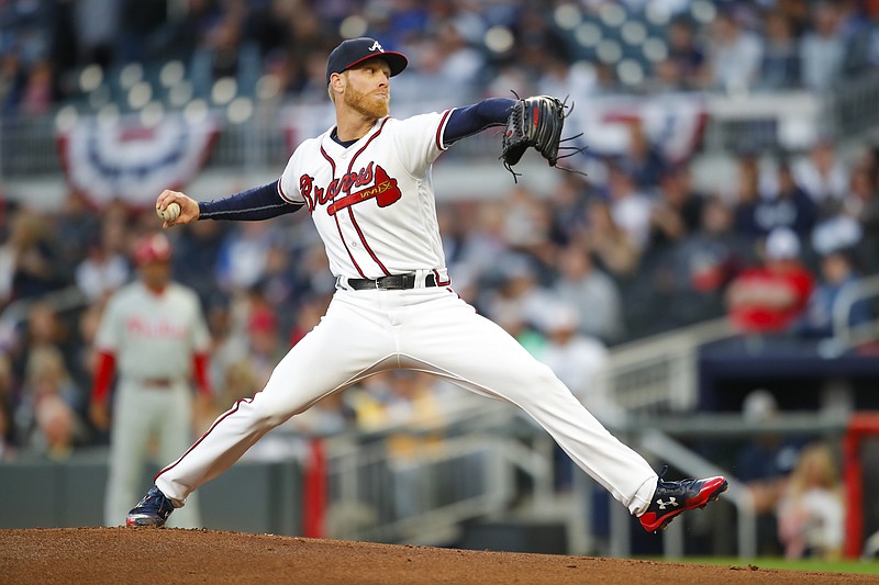Atlanta Braves starting pitcher Mike Foltynewicz (26) delivers in the first inning of a major league baseball game against the Philadelphia Phillies, Friday, March 30, 2018, in Atlanta. (AP Photo/Todd Kirkland)