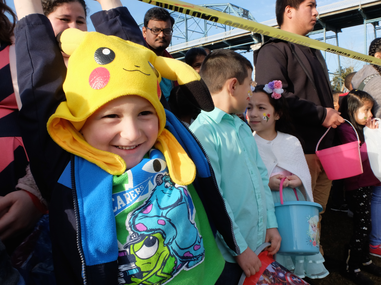 Maverick Bonine smiles as he waits for the word to go and gather Easter Eggs Sunday morning at Coolidge Park. Twins, Thiago Perez and Brianna Perez, right, 6, waits patiently prior to the start of Easter at Coolidge.