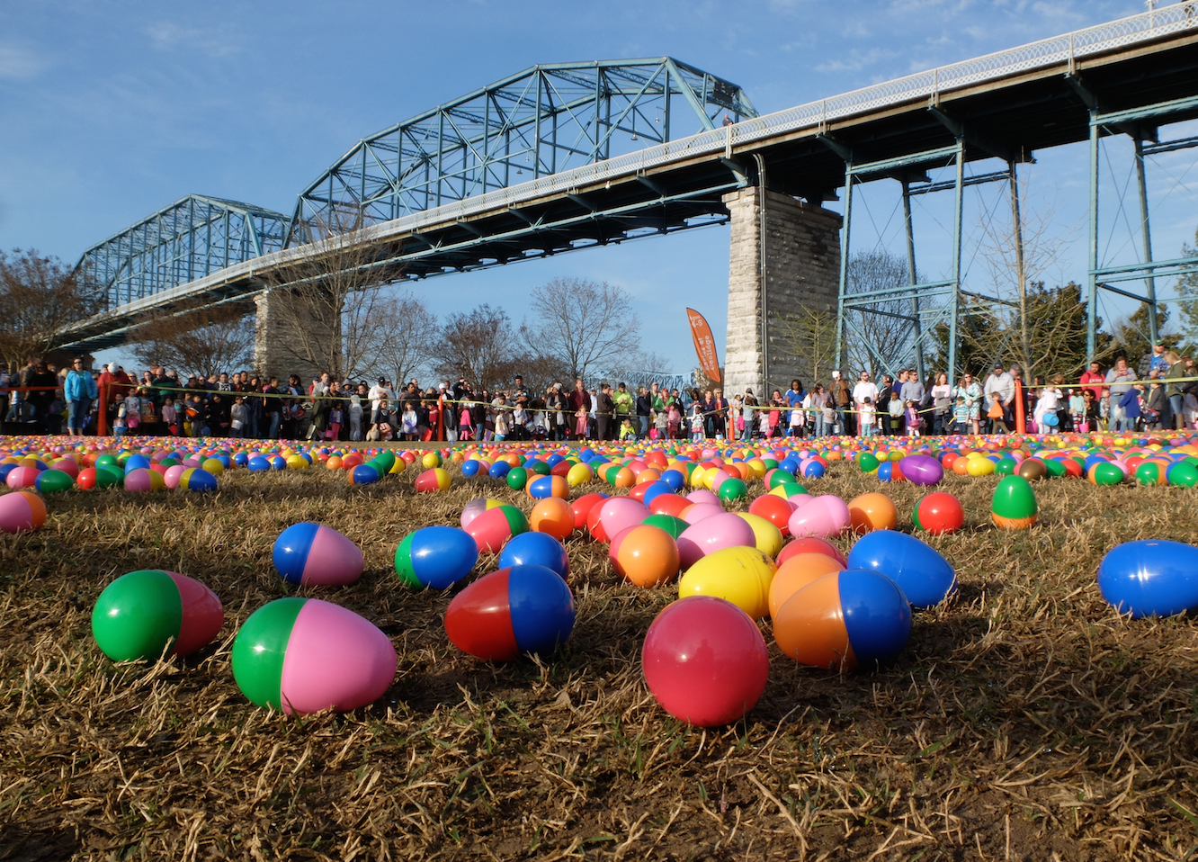 A host of children and parents await the word go beneath the Walnut Street Bridge in Coolidge Park Sunday morning before 9 a.m. There were more than 100,000 plastic Easter eggs filled with candy for the Easter at Coolidge celebration, according to Tara Higdon, of Stuart Heights Baptist Church.