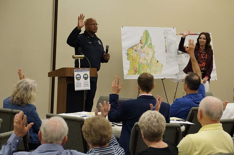 Chattanooga Police Sgt. Shawn Hickey tells residents about the department's crime prevention training program for businesses and churches during a recent community meeting. (Staff photo by Myron Madden)