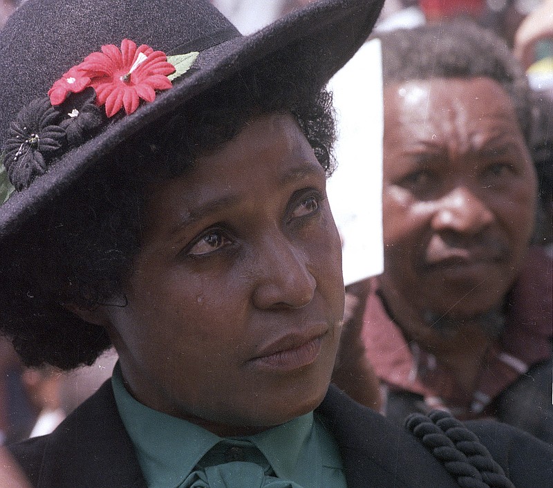 FILE -- In this March 5, 1986 file photo Winnie Mandela mourns the death of 17 black activists at a funeral service held in Johannesburg, South Africa. Madikizela-Mandela, prominent anti-apartheid activist and the ex-wife of Nelson Mandela, died in a hospital on Monday, April 2, 2018 after a long illness, her family said Monday. She was 81.  (AP Photo/Greg English, File)