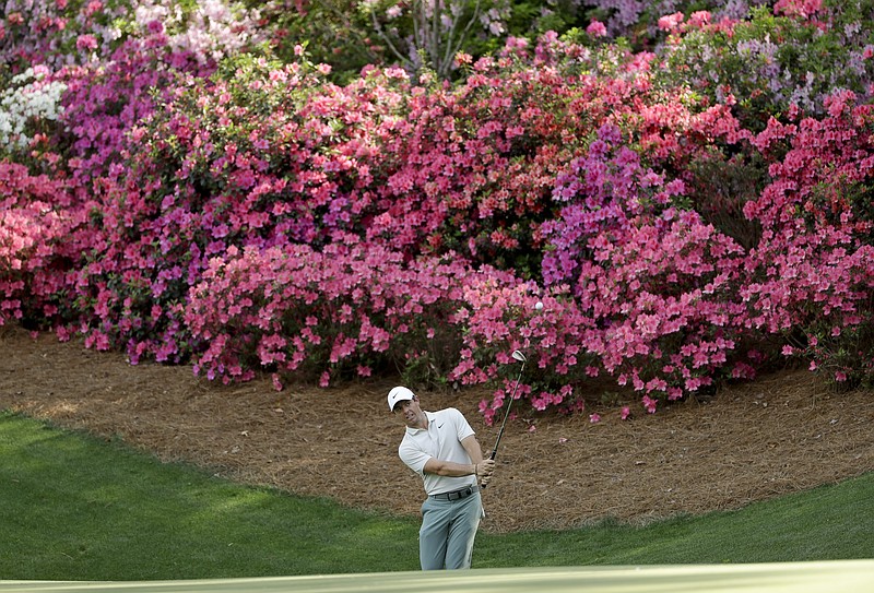 Rory McIlroy, of Northern Ireland, hits a chip on the 13th hole during practice for the Masters golf tournament at Augusta National Golf Club, Tuesday, April 3, 2018, in Augusta, Ga. (AP Photo/Matt Slocum)