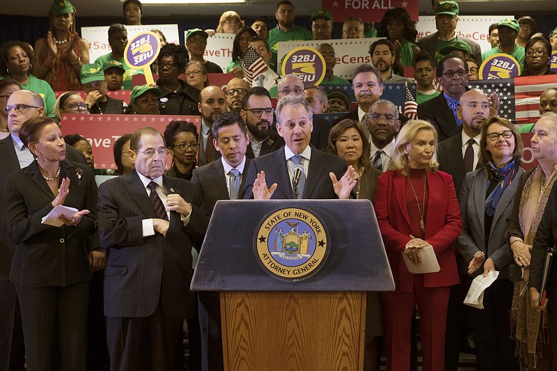 New York Attorney General Attorney General Eric Schneiderman, center, speaks during a news conference, Tuesday, April 3, 2018, in New York.