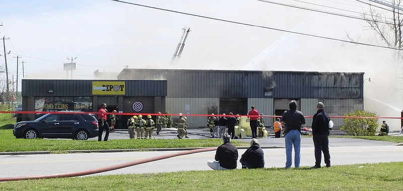 The Chattanooga Fire Department respond to a fire, just after noon, at the Shooter's Depot at 5958 Shallowford Rd on Wednesday, April 4, 2018.
