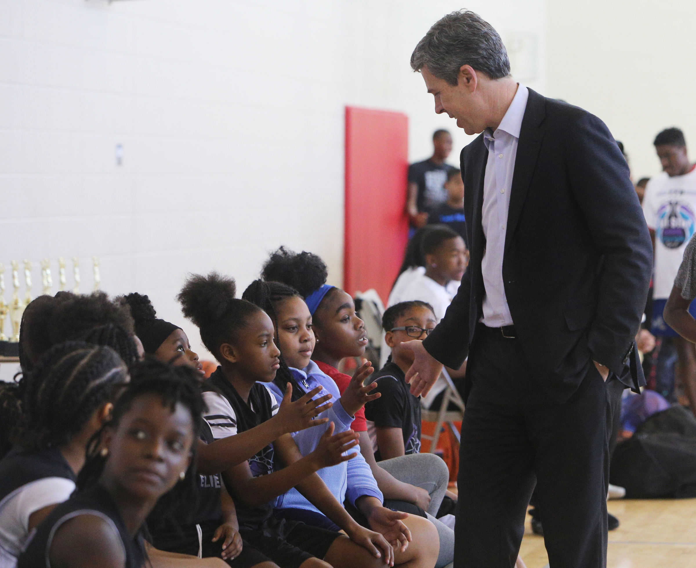 Chattanooga Mayor Andy Berke high-fives girls waiting their turn to play basketball Wednesday, April 4, 2018 during the Inaugural YFD All-Star Game at the Brainerd YFD Center in Brainerd, Tenn. Berke said the event was an opportunity give kids something productive to do during their spring break that is fun and keeps them from getting in trouble. He added, "Plus they get to see me miss a few shots."