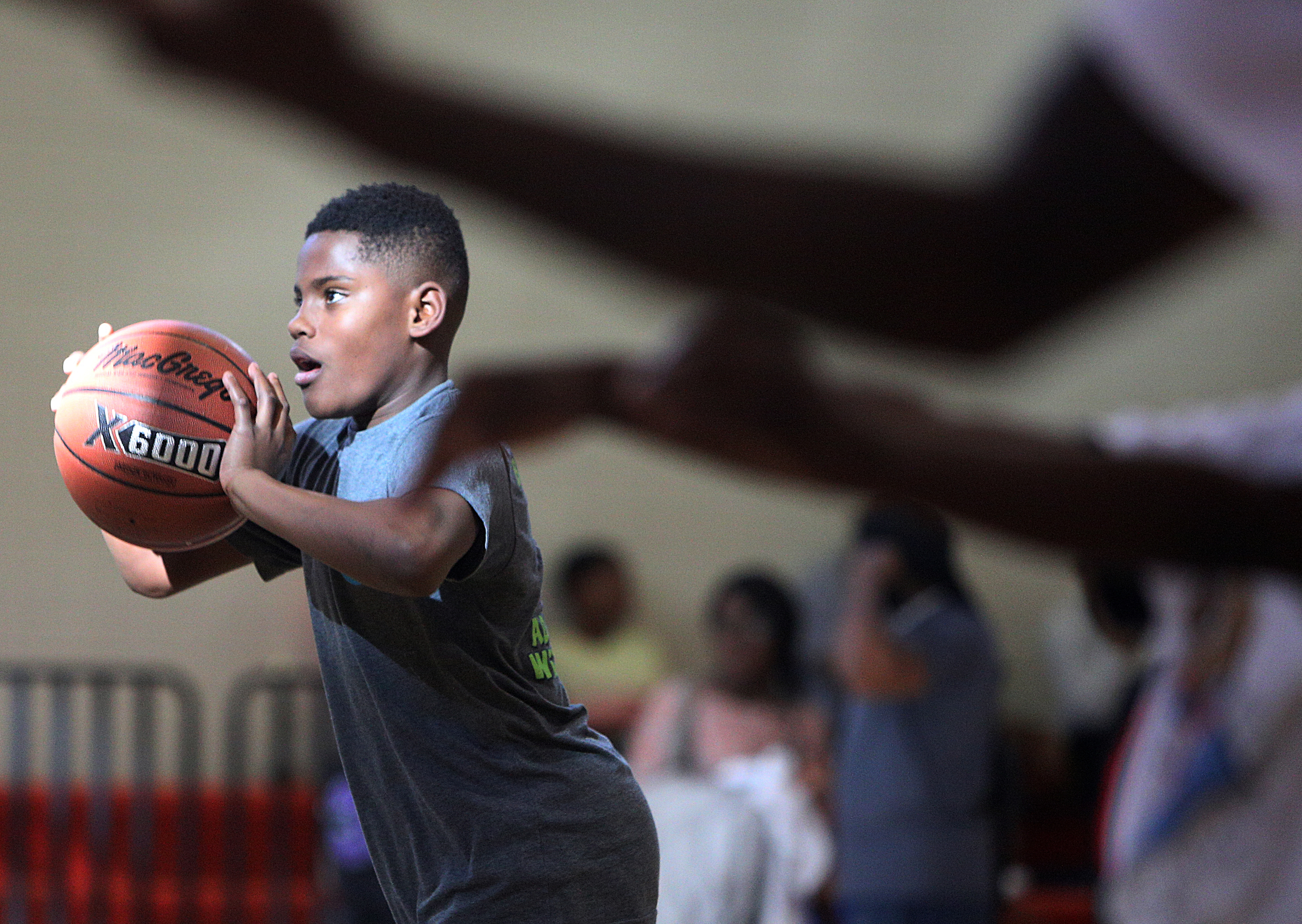 Orlando Carter, 12, takes a shot in the 3-point shootout Wednesday, April 4, 2018 during the Inaugural YFD All-Star Game at the Brainerd YFD Center in Brainerd, Tenn. Carter, who has been playing basketball since he was 4 years old, made it through several rounds of the competition before being knocked out.