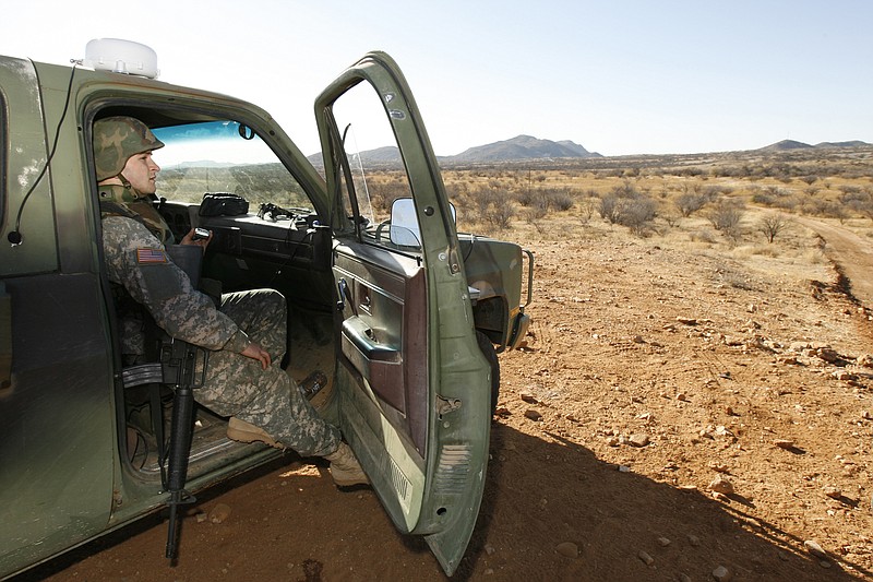 In this Friday, Jan. 19, 2007 file photo, a National Guard unit patrols at the Arizona-Mexico border in Sasabe, Ariz. President Donald Trump said April 3, 2018, he wants to use the military to secure the U.S.-Mexico border until his promised border wall is built. The Department of Homeland Security and White House did not immediately respond to requests for comment. At the Pentagon, officials were struggling to answer questions about the plan, including rudimentary details on whether it would involve National Guard members, as similar programs in the past have done. But officials appeared to be considering a model similar to a 2006 operation in which former President George W. Bush deployed National Guard troops to the southern border in an effort to increase security and surveillance.(AP Photo/Ross D. Franklin, file)