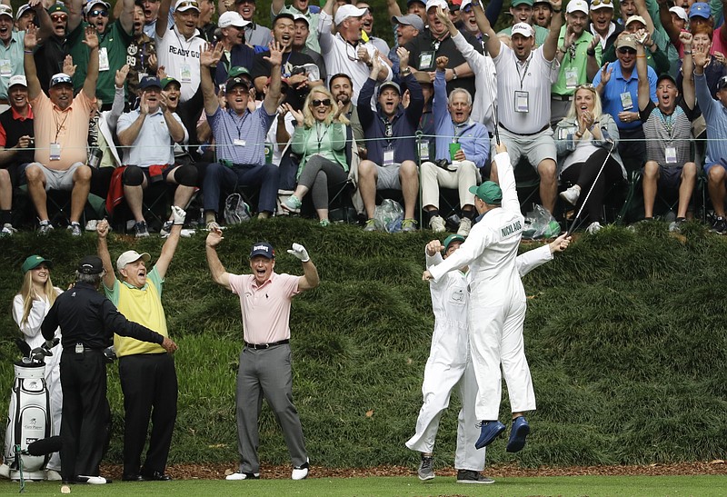 Jack Nicklaus' grandson and caddie GT Nicklaus reacts after his hole-in-one on the ninth hole during the par three competition at the Masters golf tournament Wednesday, April 4, 2018, in Augusta, Ga. (AP Photo/Matt Slocum)