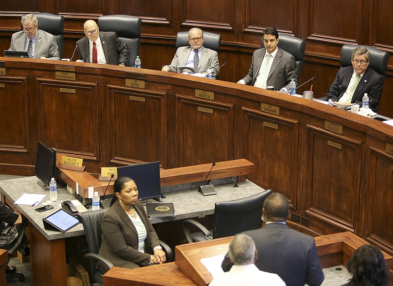 Members of the Hamilton County Commission listen as NAACP executive board member Yusuf Hakeem speaks, in reference to the removal of the Confederate Lt. Gen. A.P. Stewart bust from the front of the courthouse, in the County Commission assembly room at the Hamilton County Courthouse on Wednesday, Oct. 4, in Chattanooga, Tenn.