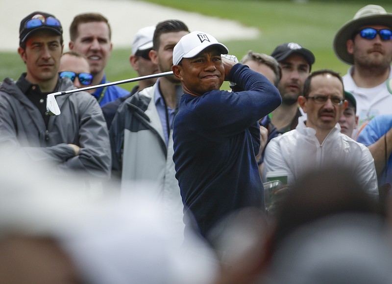 Tiger Woods hits from the third tee during a practice round for the Masters golf tournament Wednesday, April 4, 2018, in Augusta, Ga. (AP Photo/Chris Carlson)