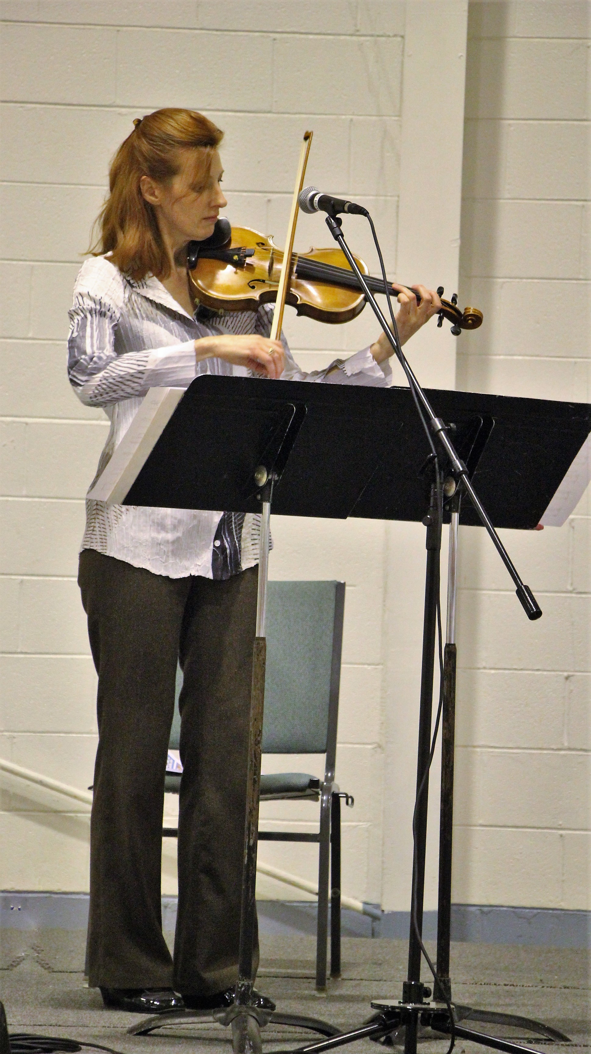 Holly Mulcahy performs in front of 128 Walker State Prison's Faith and Character Based inmates.