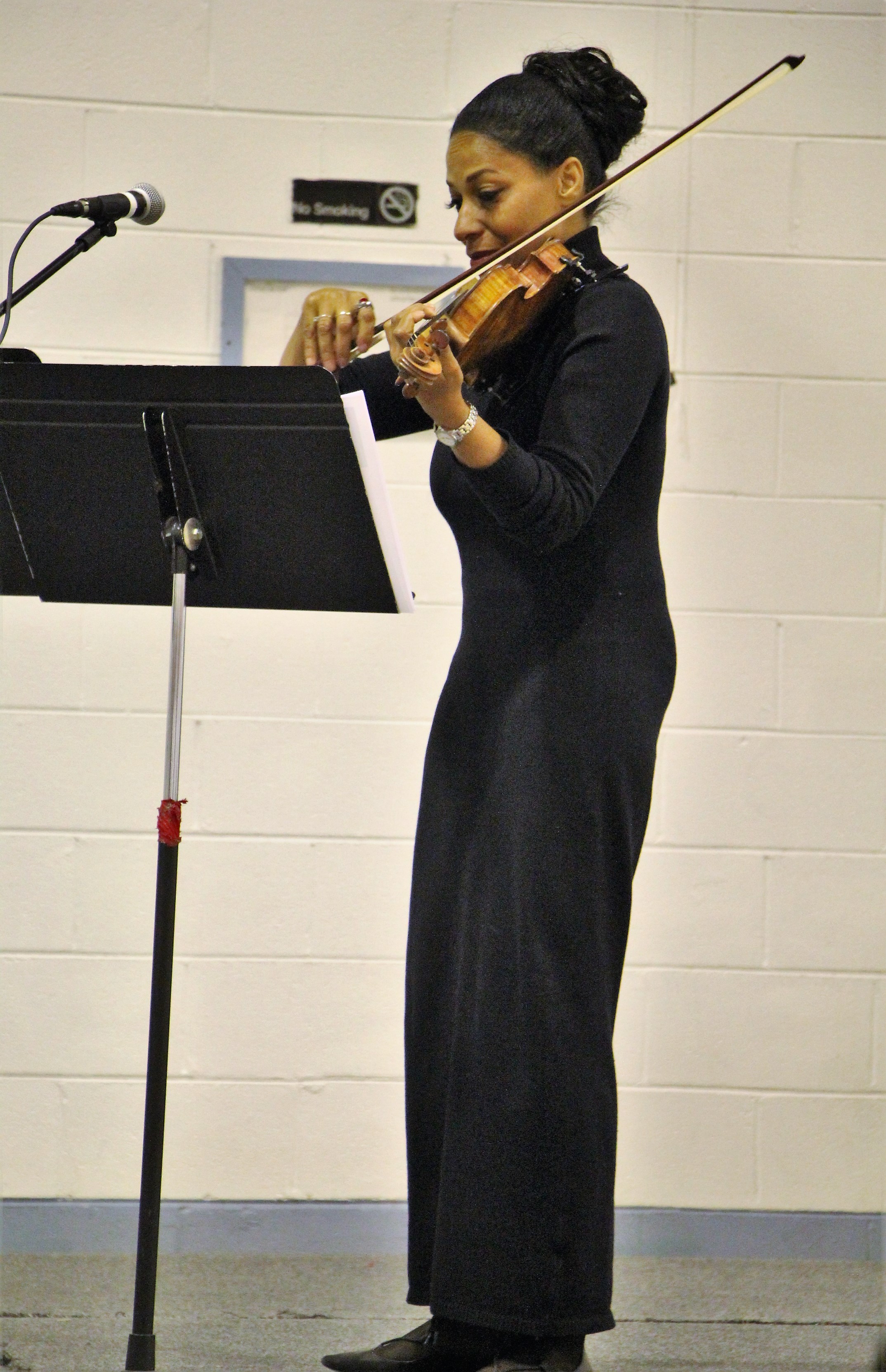 Mary Corbett performs in front of 128 Walker State Prison's Faith and Character Based inmates.
