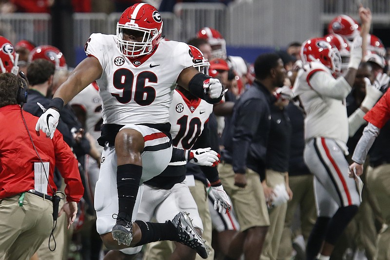 Georgia defensive tackle DaQuan Hawkins-Muckle (96) celebrates after blocking an Auburn field-goal try during the third quarter of last December's SEC championship game in Atlanta.