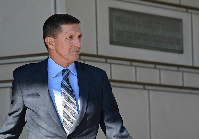 In this Dec. 1, 2017, file photo, former national security adviser Michael Flynn for President Donald Trump leaves federal court in Washington. Robert Mueller's Russia investigation is illustrating an age-old truism: It pays to cooperate with the government. The few people who so have cooperated with the special counsel's office have enjoyed perks including the prospect of reduced prison sentences. Flynn flies cross-country to stump for a California congressional candidate and books a speaking event in New York. (AP Photo/Susan Walsh, File)
