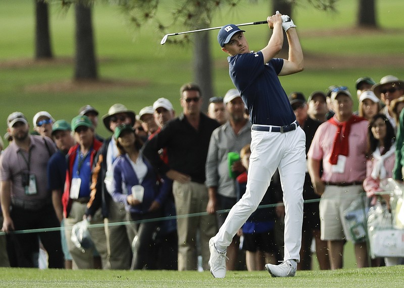Jordan Spieth hits a shot on the 17th hole during the first round at the Masters golf tournament Thursday, April 5, 2018, in Augusta, Ga. (AP Photo/David J. Phillip)