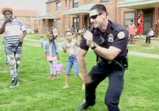 This screenshot from a video shows Chattanooga police officer Michael Ampthor dancing at East Lake Courts during an Easter event.