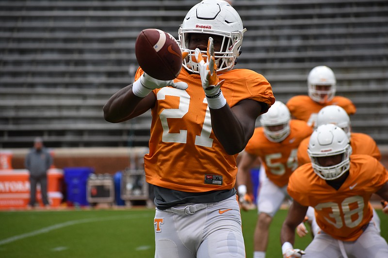 Linebacker Shanon Reid catches a football during drills before Tennessee's scrimmage at Neyland Stadium on April 7.
