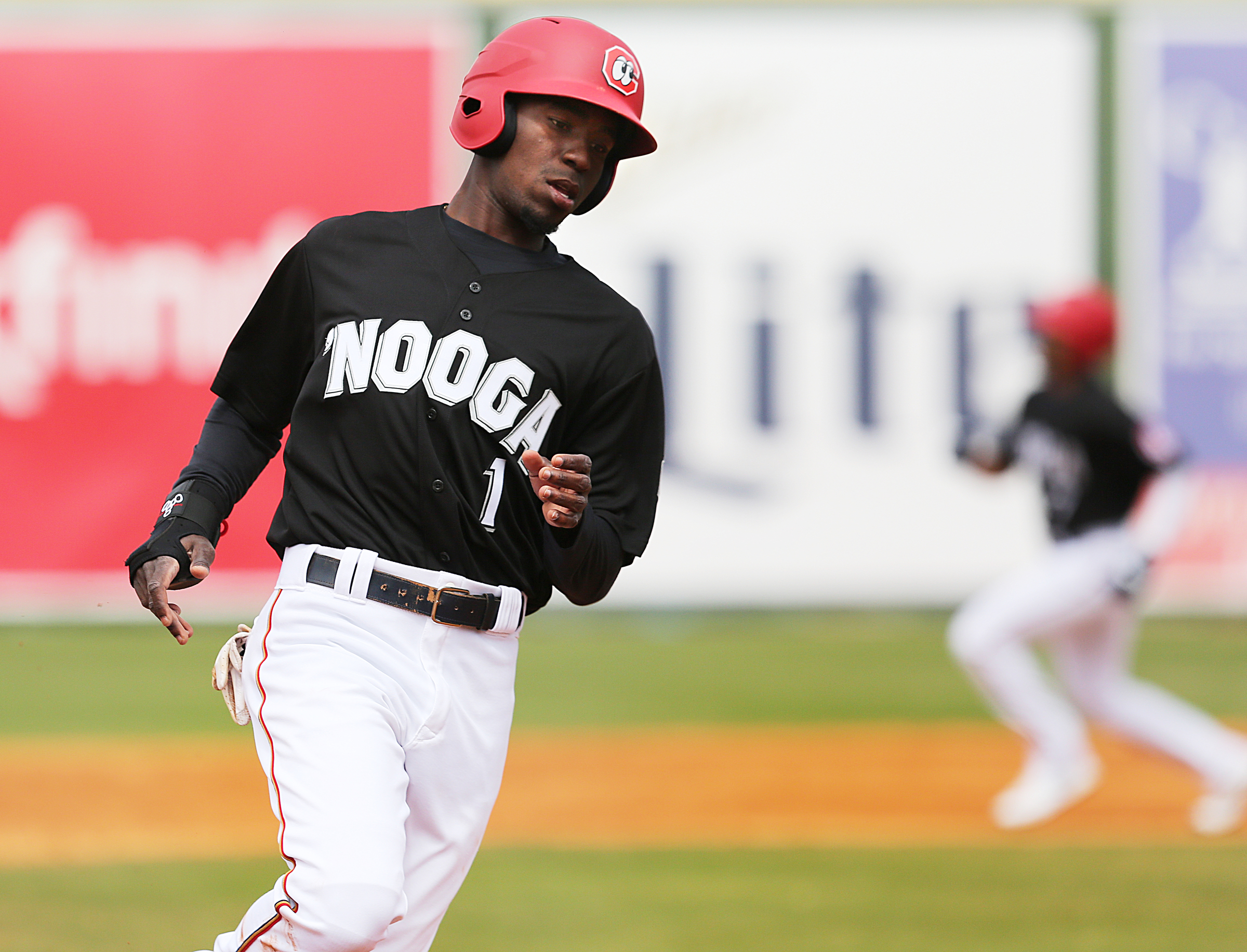 Chattanooga Lookouts' Nick Gordon (1) rounds third on a teammate's hit Sunday, April 8, 2018 during the Lookouts game against the Barons at AT&T Field in Chattanooga, Tenn.
