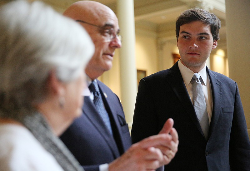 Colton Moore, at right, listens as State Rep. John Deffenbaugh, R-Lookout Mountain, describes what is happening Thursday, March 29, 2018 in the House of Representatives at the Georgia State Capitol in Atlanta, Ga. Moore is Deffenbaugh's opponent in this year's election and was invited by Deffenbaugh to spend last Wednesday and Thursday at the Capitol learning more about what the job of State Representative entails from a first-hand perspective. 