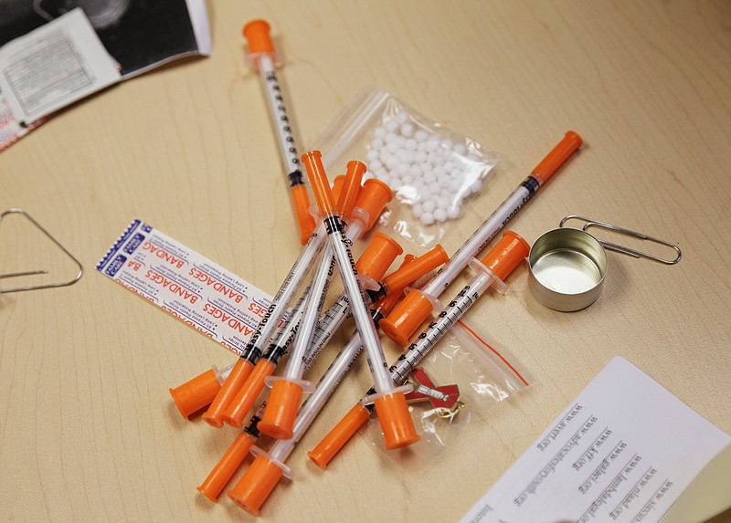 An example of a care kit which includes clean syringes, bandages, sterile wipes and a clean cooking container is demonstrated at Chattanooga CARES on Friday, April 6, 2018, in Chattanooga, Tenn. Chattanooga CARES has implemented the city's first syringe exchange program, which provides clean syringes in exchange for used needles in an effort to reduce HIV and hepatitis infections among intravenous drug users.