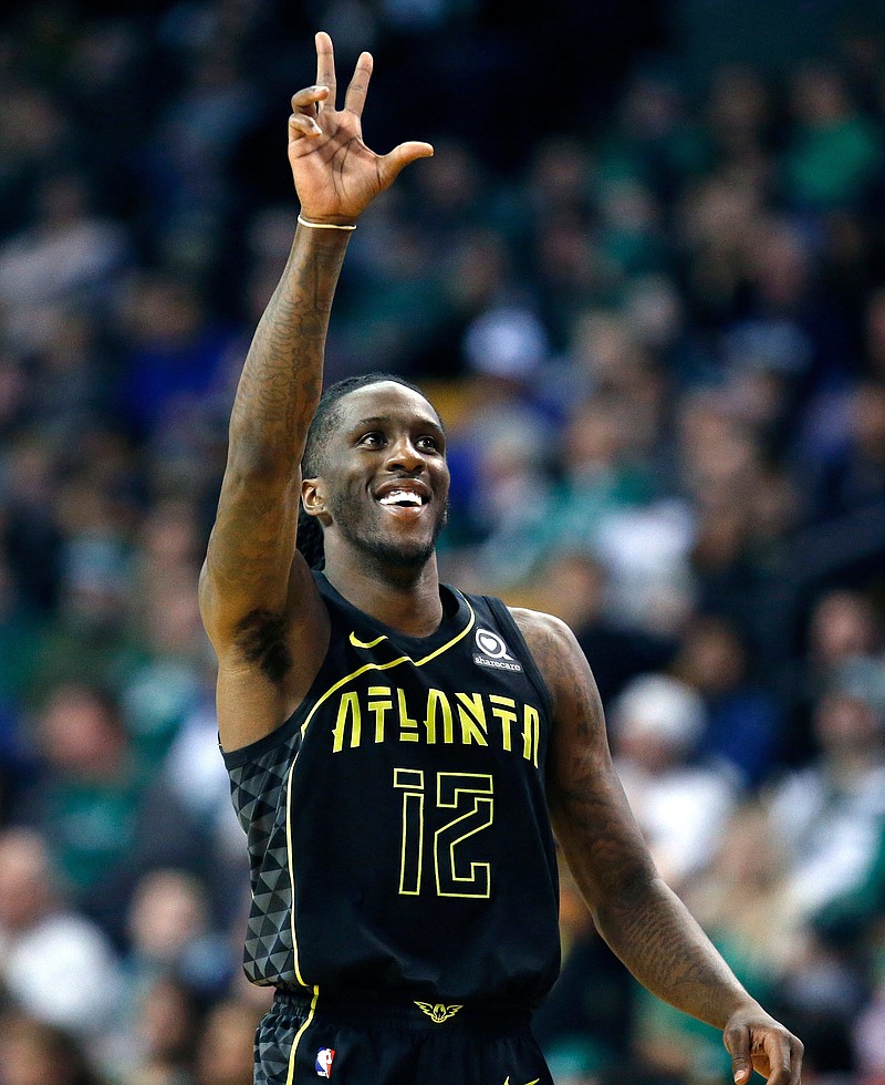 Atlanta Hawks' Taurean Prince celebrates after making a three-point basket during the fourth quarter of an NBA basketball game against the Boston Celtics in Boston, Sunday, April 8, 2018. (AP Photo/Michael Dwyer)