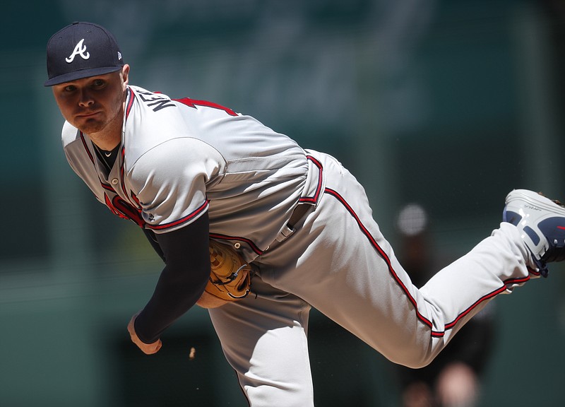 Atlanta Braves starting pitcher Sean Newcomb delivers a pitch to Colorado Rockies' Chris Iannetta in the first inning of a baseball game Sunday, April 8, 2018, in Denver. (AP Photo/David Zalubowski)
