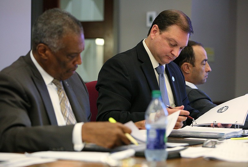 Chattanooga city councilmen Erskine Oglesby Jr., Darrin Ledford and Ken Smith are shown during a city council meeting.