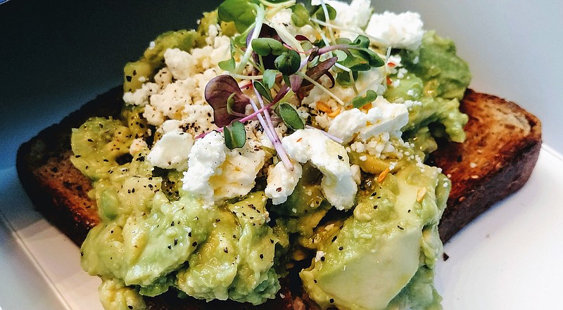 Avocado toast at Bluestone Lane Cafe in New York is topped with feta and watercress.