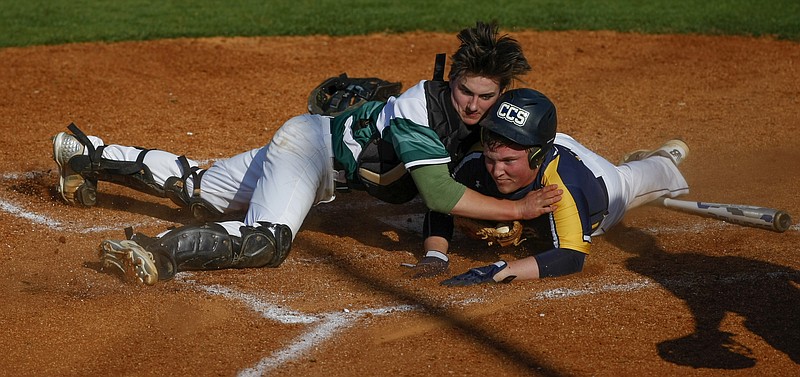 Silverdale's Jarrett Clift, left, tags Chattanooga Christian's Austin Vincent at home plate during their game at Silverdale Baptist Academy on Tuesday, April 10, 2018 in Chattanooga, Tenn.