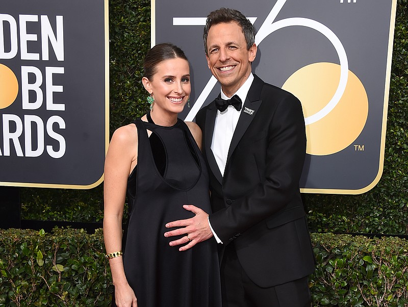 
              FILE - In this Jan. 7, 2018 file photo, Alexi Ashe, left, and Seth Meyers arrive at the 75th annual Golden Globe Awards in Beverly Hills, Calif. Myers  host told his audience on “Late Night with Seth Meyers," Monday, April 9, 2018, that his new son was born in the lobby of their apartment building on Sunday. (Photo by Jordan Strauss/Invision/AP, File)
            