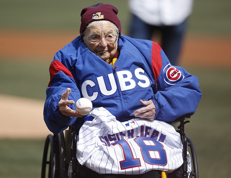 Loyola University Chicago's Sister Jean throws out a ceremonial pitch prior to the start of the Cubs' home opening baseball game against the Pittsburgh Pirates Tuesday, April 10, 2018, in Chicago. (AP Photo/Jim Young)