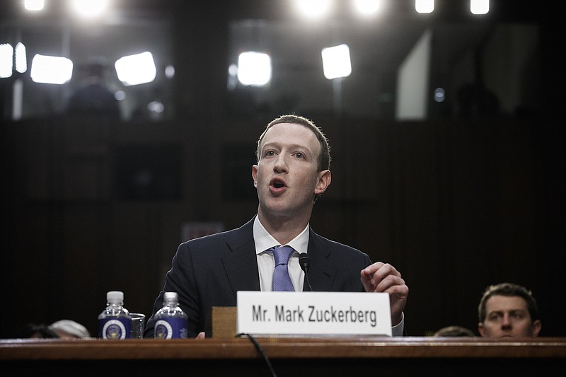 Mark Zuckerberg, the chief executive of Facebook, testifies at a joint Senate Judiciary and Commerce Committee hearing, on Capitol Hill in Washington, on Tuesday. Zuckerberg faced tough questions on the company's mishandling of data in a series of debacles over the past year.